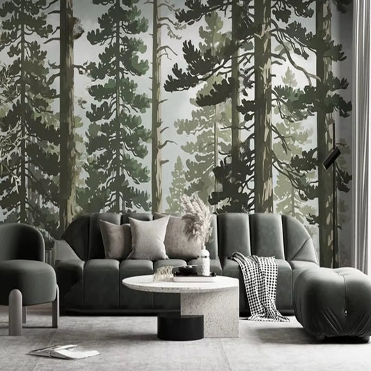 Papier peint panoramique La Grande Pinède derrière un canapé en velours vert sapin, pouf assorti et plaid pied-de-poule