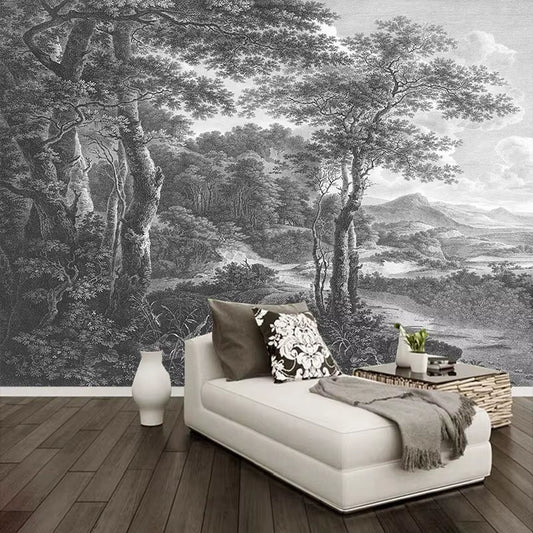 Papier peint panoramique Arcadie derrière une méridienne blanche, coussins noir et blanc et parquet foncé